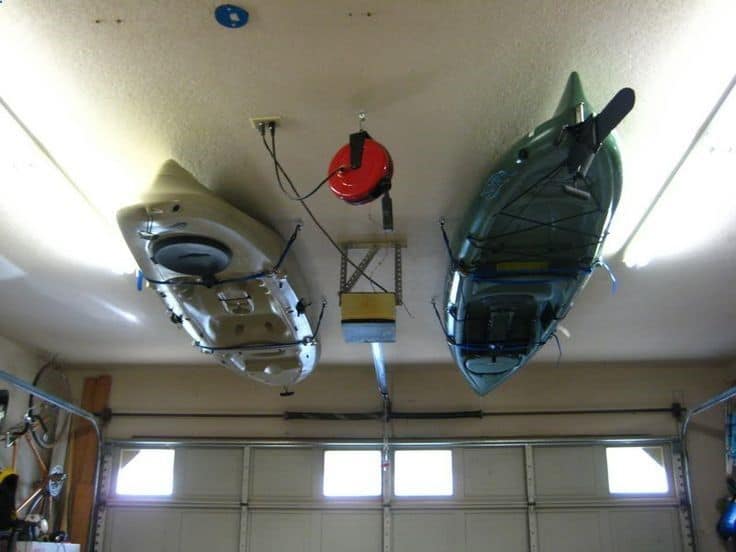 Kayaks above the cars in the garage